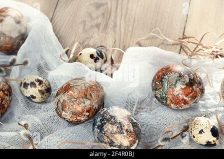 Easter composition - Easter eggs painted with natural dyes on a wooden table. Stock Photo