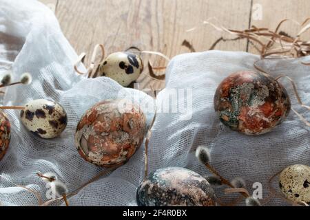 Easter composition - Easter eggs painted with natural dyes on a wooden table Stock Photo