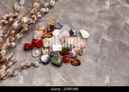 Multiple semi precious gemstones on board. Gemstones crystal minerals Stock Photo