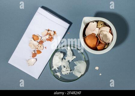 Eggshell membrane. Collagen from eggshell membranes. Zero waste cosmetics. Composition on blue background. Top view. Stock Photo