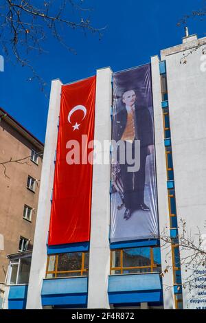 Ankara, Turkey - March 13, 2021 - Mustafa Kemal Atatürk poster and Turkish flag on a building in central Ankara Stock Photo