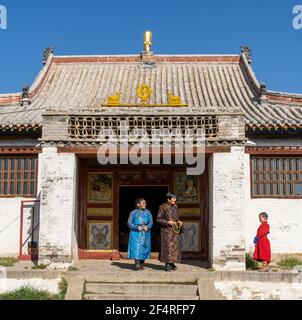 Shankh, Mongolia - August 29, 2019: Temple of the Shankh Monastery with young monk in front of the temple during summer. Stock Photo