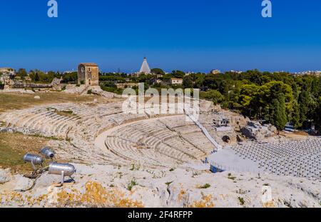 Syracusa, Italy - July 27, 2020 - sunset view of the Greek amphitheatre with stage and chairs in Neapolis Archaeological Park - Syracusa, Sicily Stock Photo