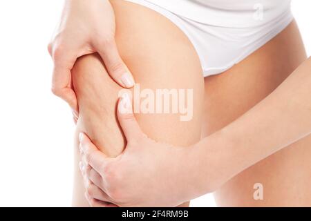Woman does outdoor stretching with her personal trainer on a great summer day Stock Photo
