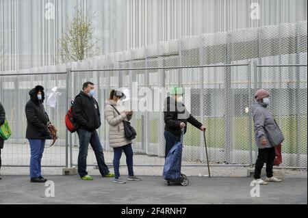 Milan (Italy), the non-profit organisation Pane Quotidiano (Daily Bread) distributes essential foodstuffs to people in economic difficulty due to the crisis caused by the Coronavirus epidemic. More and more social groups are affected, and every day the queue gets longer. Stock Photo