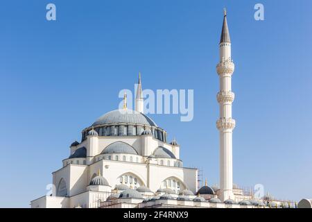 Dome and minaret of Sharjah Masjid mosque, The New Sharjah Mosque, the largest mosque in the Emirate of Sharjah, the United Arab Emirates Stock Photo