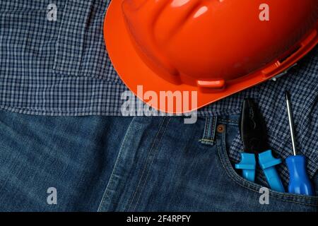 Concept of Labor Day with tools on jeans, close up Stock Photo