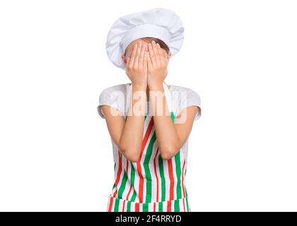 Cute girl in chef uniform isolated on white background covering eyes with hands Stock Photo