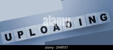 uploading word on wooden cubes. Internet resources concept Stock Photo