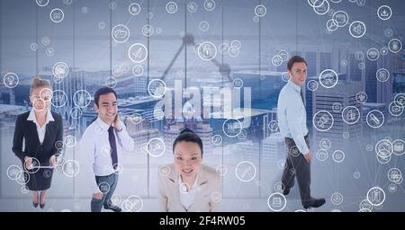 Composition of network with digital icons over business people in office Stock Photo