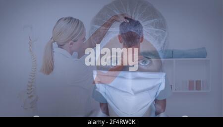 Portrait of female health worker wearing face mask against female doctor doing neck adjustment Stock Photo