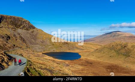 Hikers at the summit of Snowdon in North Wales, UK Stock Photo