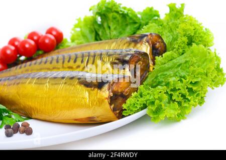 Appetizing smoked fish on a platter Stock Photo