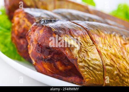 Appetizing smoked fish on a platter Stock Photo