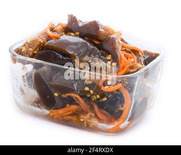 Roasted and marinated vegetables salad with carrot in a glass bowl Stock Photo
