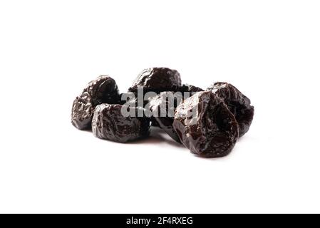 Dried prunes isolated on a white background. Dried prunes on white. Dried prunes with copy space for text. Stock Photo