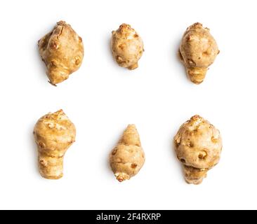 Raw jerusalem artichoke. Topinambur vegetable root isolated on white background. Stock Photo