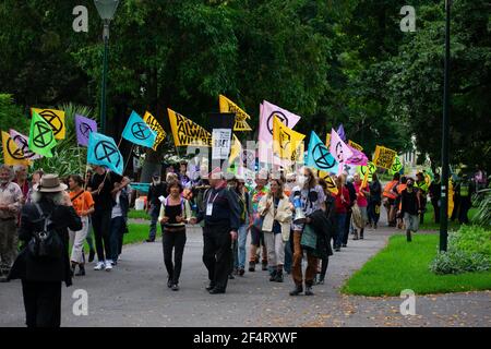 Melbourne, Australia. 23rd March 2021. Extinction Rebellion protesters gather in Carlton Gardens before marching through the city as they attempt to raise public awareness on the issue of climate change inaction. Credit: Jay Kogler/Alamy Live News Stock Photo