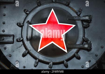 Red star sign on a black vintage Soviet steam locomotive. Close up photo Stock Photo