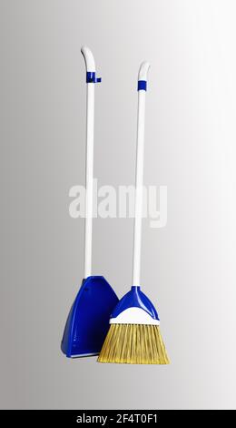 Broom with dustpan set. Close-up. Isolated on a gray background. Stock Photo