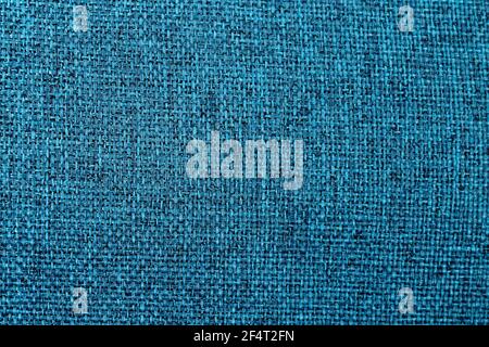 Blue linen canvas. Background of azure cloth thread texture. Fabric with natural texture. Large seamless texture, close up Stock Photo
