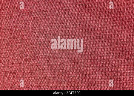 Dark red, burgundy, grainy textured surface, top view, banner. Background of magenta cloth thread texture. Small geometric seamless fabric texture. Copy space Stock Photo