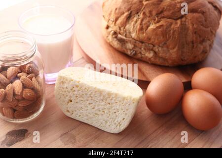 Fresh dairy products, milk, cottage cheese, eggs, yogurt on table Stock Photo
