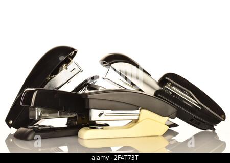 Several stationery staplers on a white background. Stock Photo