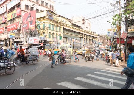 Crowded city street of Bara Bazar, a lively shopping district of Calcutta on a busy working day. Burrabazar, Kolkata West Bengal India South Asia Paci Stock Photo