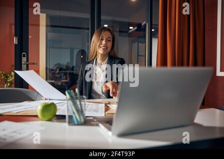 Joyous lady engineer working in her office Stock Photo