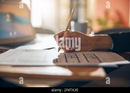 Engineer modifying a house plan with a pencil Stock Photo