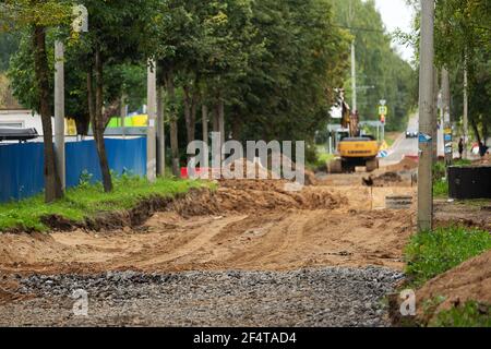poorly executed road repairs. replacing the old curb stone with a new one Stock Photo