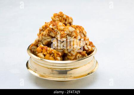 Peanut bar,crunchy sweet peanut bar which is very healthy and tasty snack,arranged on a white textured background. Stock Photo