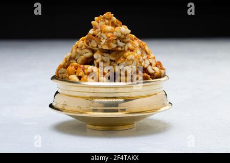 Peanut bar,crunchy sweet peanut bar which is very healthy and tasty snack,arranged on a white textured ,selective focus. Stock Photo
