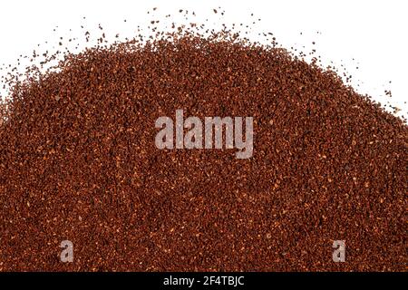 Pile of fresh ground coffee isolated on white background Stock Photo