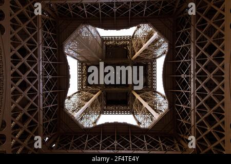 A look from under the Eiffel Tower in Paris, France. Stock Photo