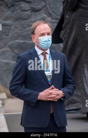 Lonon, UK. 23rd Mar, 2021. Those who have suffered from coronavirus remembered on one year lockdown anniversary with one minute silence at St Thomas hospital opposite the Houses of Parliament. Held at the statue of Mary Seacole on Westminster Bridge. 126000 people have so far died from the virus. NHS England Chief Executive Sir Simon Stevens.  Credit: JOHNNY ARMSTEAD/Alamy Live News Stock Photo