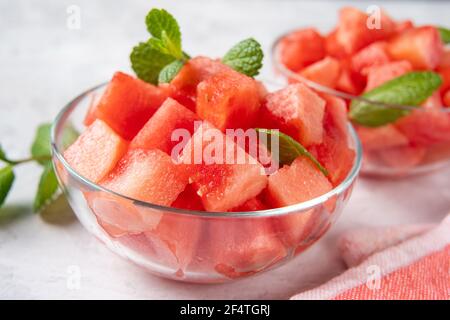 Crop shot of glass bowl with juicy and sweet watermelon cubes Stock Photo