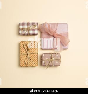 Gift boxes on beige background. flat lay, top view, copy space Stock Photo