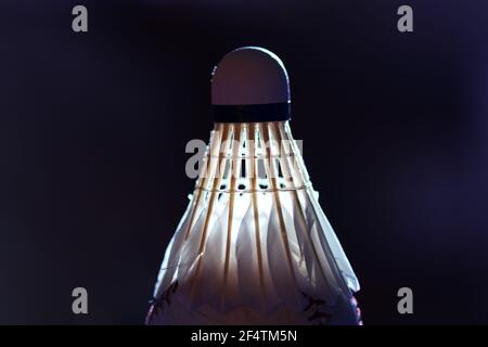 Shuttlecock made by feathers in dim light . Goose Feather Badminton Shuttlecocks with Great Stability Stock Photo