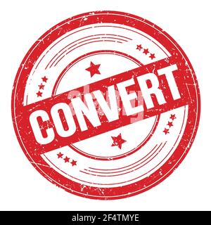 CONVERT text on red round grungy texture stamp. Stock Photo