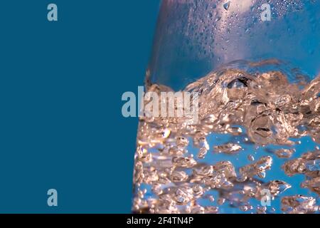 A water is boiled in an electric kettle with transparent walls, close up. Stock Photo