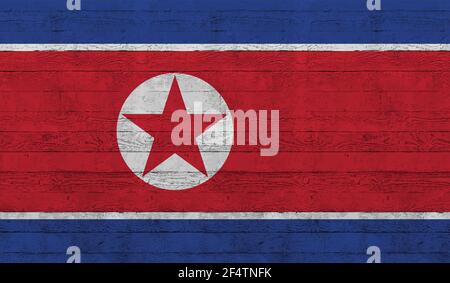 North Korea flag with waving grunge texture. Vector background. Stock Vector