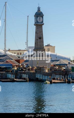 Old port of Barcelona. Torre del Rellotge one of the city most iconic buildings, was built in 1772 in Port Vell. Clock Tower in Barcelona, Spain. Stock Photo