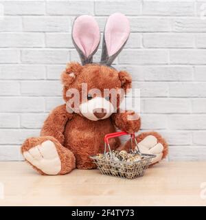 Cute brown toy with quail eggs Stock Photo