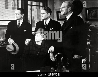 JOAN FONTAINE, REGINALD DENNY, LAURENCE OLIVIER and C. AUBREY SMITH in REBECCA (1940), directed by ALFRED HITCHCOCK. Credit: Selznick International Pictures / Album Stock Photo