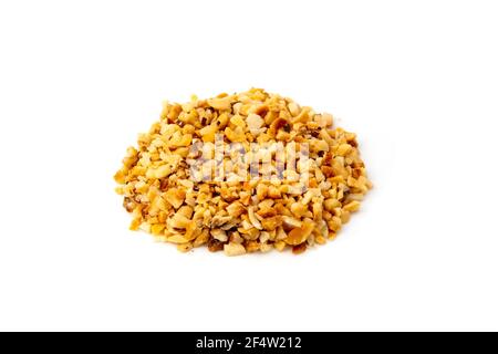 Granulated hazelnuts on a white background Stock Photo