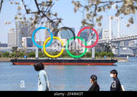 Tokyo, Japan. 23rd Mar, 2021. This Monument to the Tokyo Olympics (Tokyo 2020) in Odaiba near the Rainbow bridge in Tokyo, Japan on March 23, 2021. As the Cherry blossoms in full bloom and people walk around enjoying spring break. The games were originally set to begin July 24, 2020, but they have been delayed due to the Covid-19 pandemic. The games have been tentatively rescheduled for July 23, 2021. (Photo by Kazuki Oishi/Sipa USA) **Japan Out** Credit: Sipa USA/Alamy Live News Stock Photo