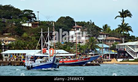 Landscape with view of a traditional sightseeing Schooner on the waters of Armação dos Búzios, the renown resort town of Rio de Janeiro, Brazil. Stock Photo