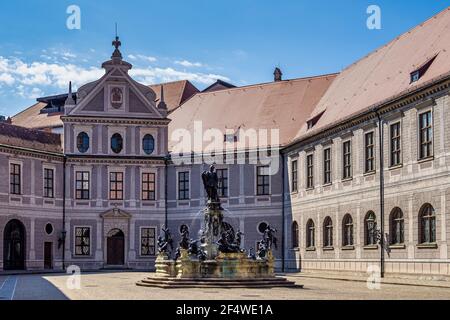 The bronze Wittelsbach Fountain in the Residenz Palace was erected in 1610. Munich, Germany. Octagonal yard called Fountain Courtyard, Brunnenhof, is Stock Photo